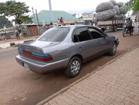 A perfectly sound, grey blue Toyota Corolla 1997 DX, tinted 
